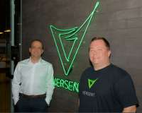 Thor Essman and Sidney Minassian Standing infront of Versent Logo