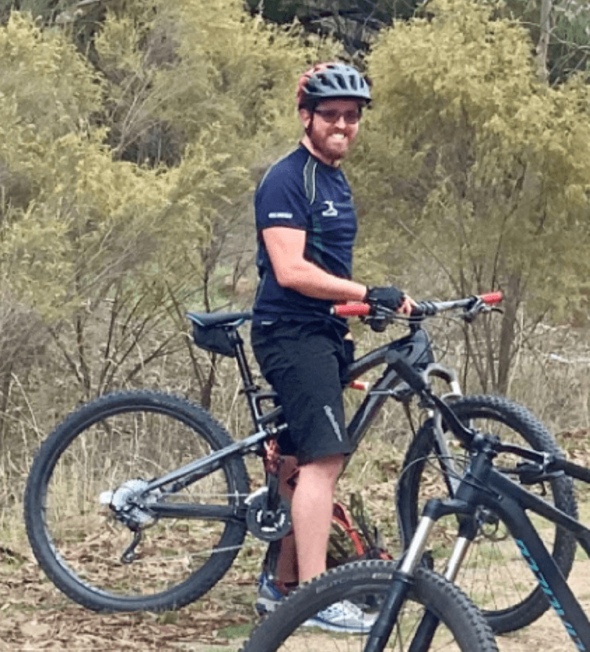 Versent Employee Sam Dammers with bike for mental health and TourXOz