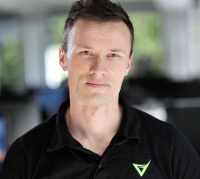 Headshot of Hamish Ridland Head of Delivery at Versent with the Versent logo on polo shirt