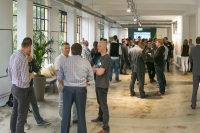 Melbourne office event space with people talking in groups