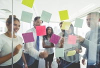 Tech team working on post it notes