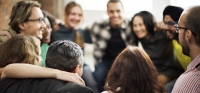 Group of Versent employees in team meeting